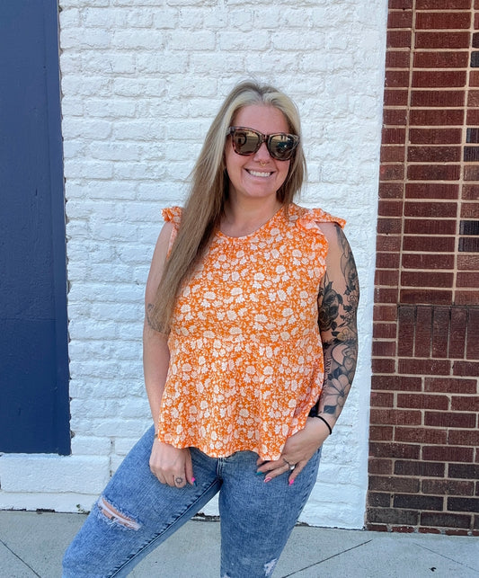 Sleeveless Ruffle Edge Round Neck
Peplum Floral Print Top